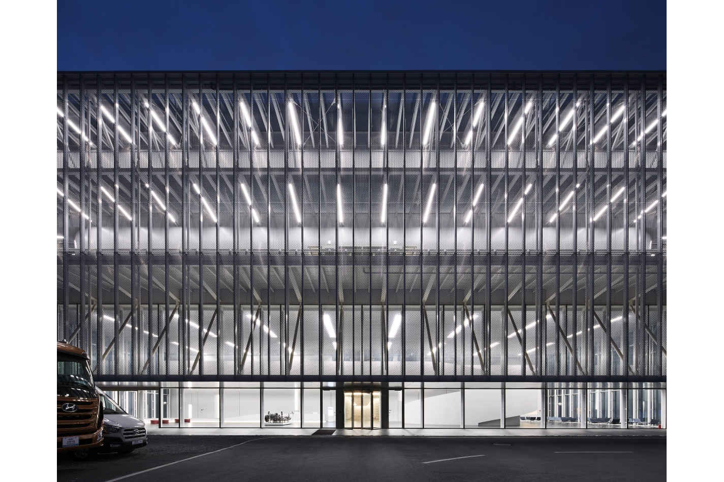 Night view of the glowing multi-storey facade