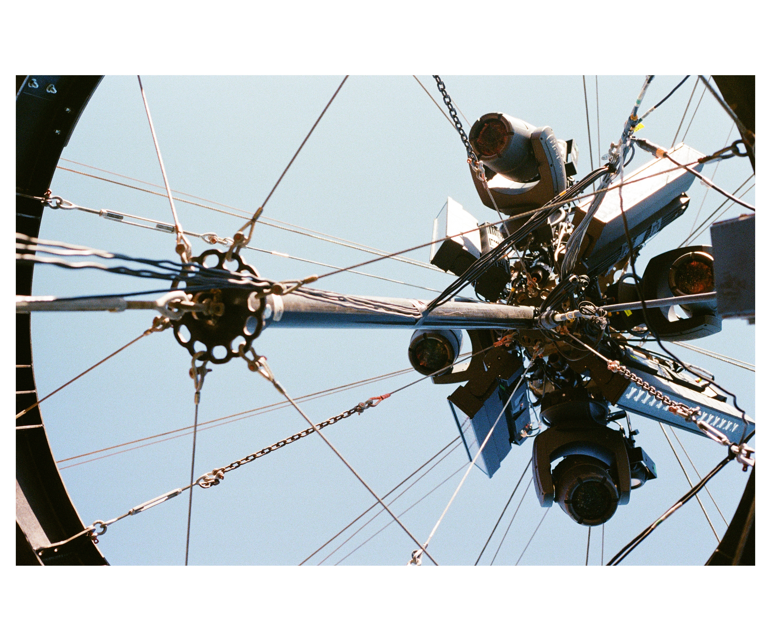 Looking up at moving lights, cables and the steel ring